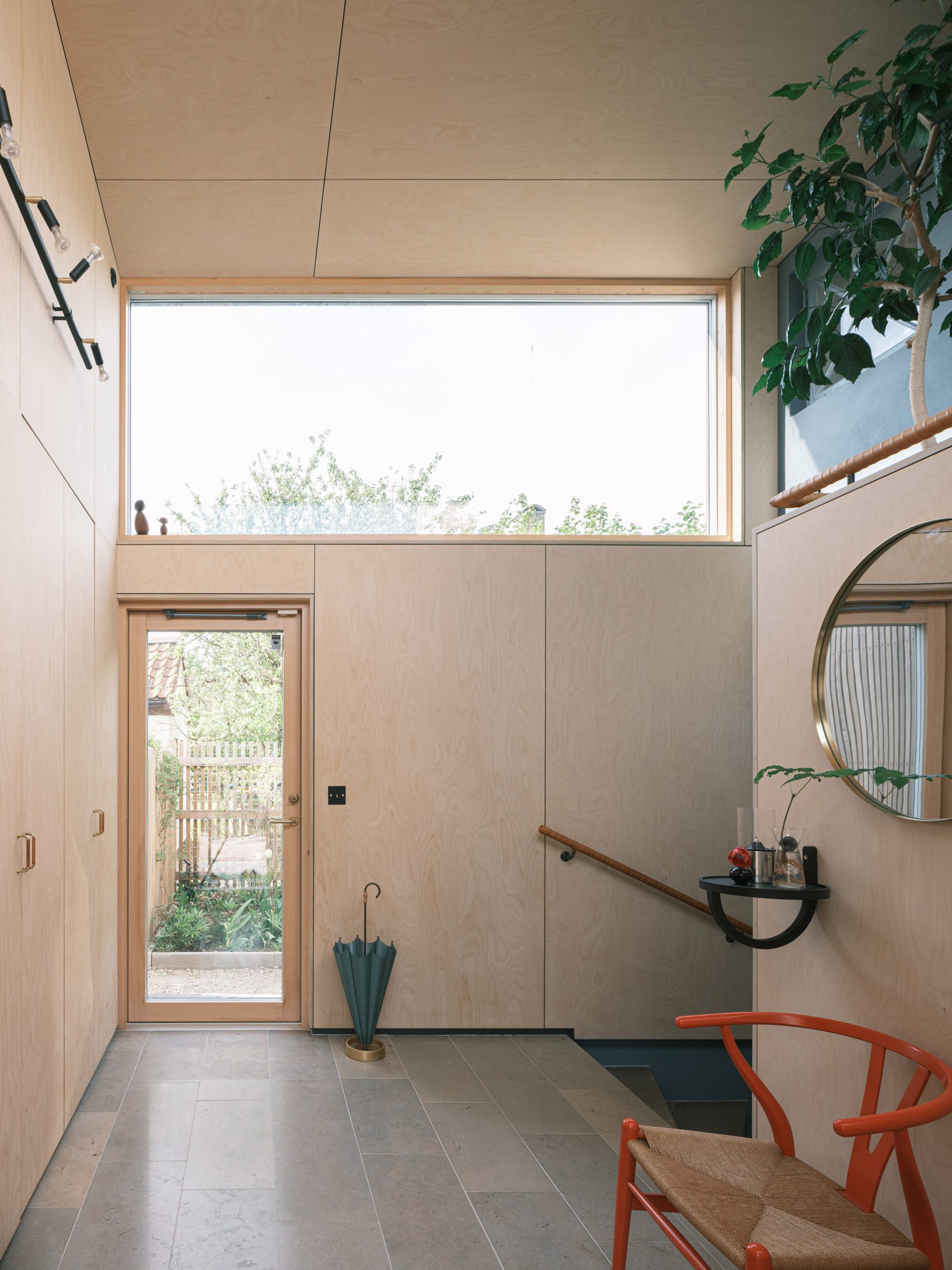 Plywood-lined hallway by Johan Sundberg Arkitektur