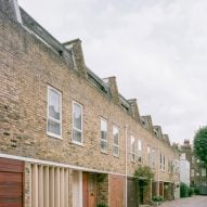 Exterior of a terrace of mews houses in London with bespoke timber louvres designed by Trewhela Williams