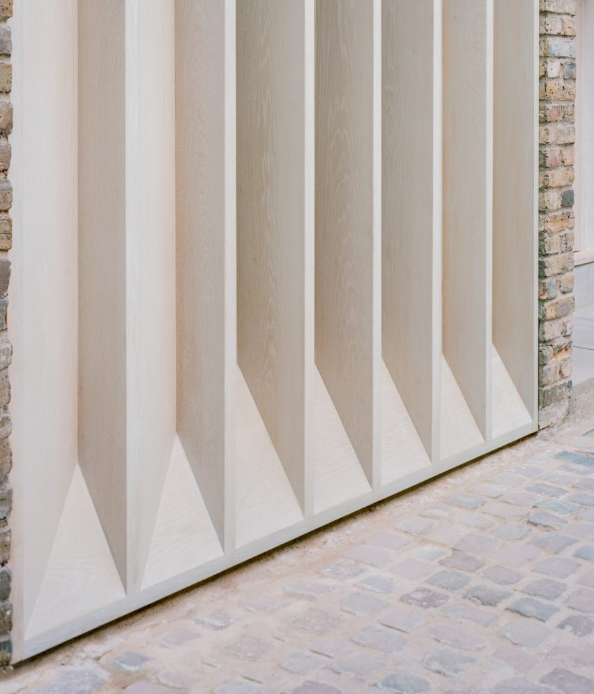 Close up of the bespoke timber louvres at a mews house designed by Trewhela Williams