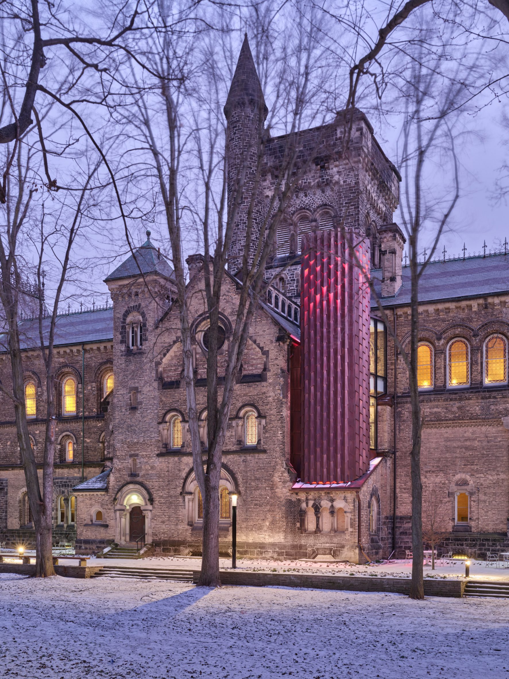 Contemporary elevator added to gothic-style building