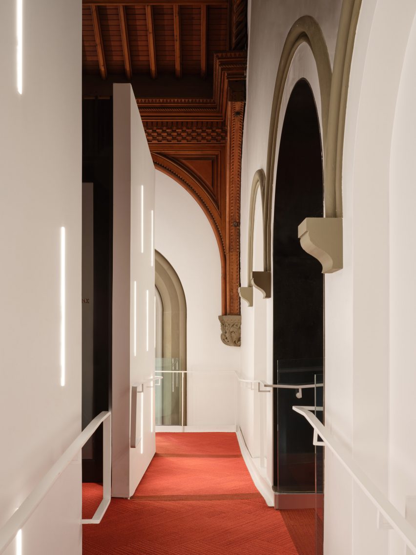 Red carpet contrasts historic architectural details