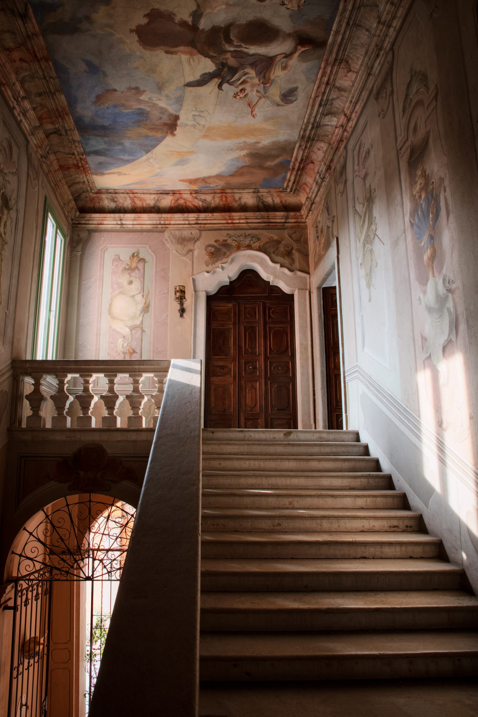 Staircase within Palazzo Monti with frescos