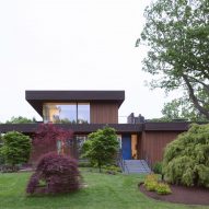 Exterior of the timber-clad lake house in Connecticut by Worrell Yeung