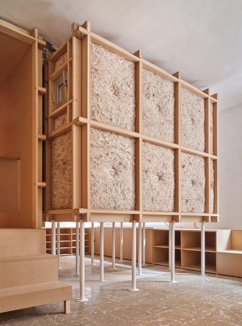 High-rise bedroom wrapped in wool and MDF