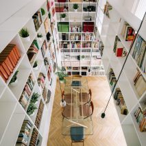 White bookshelves inside House 6 in Spain
