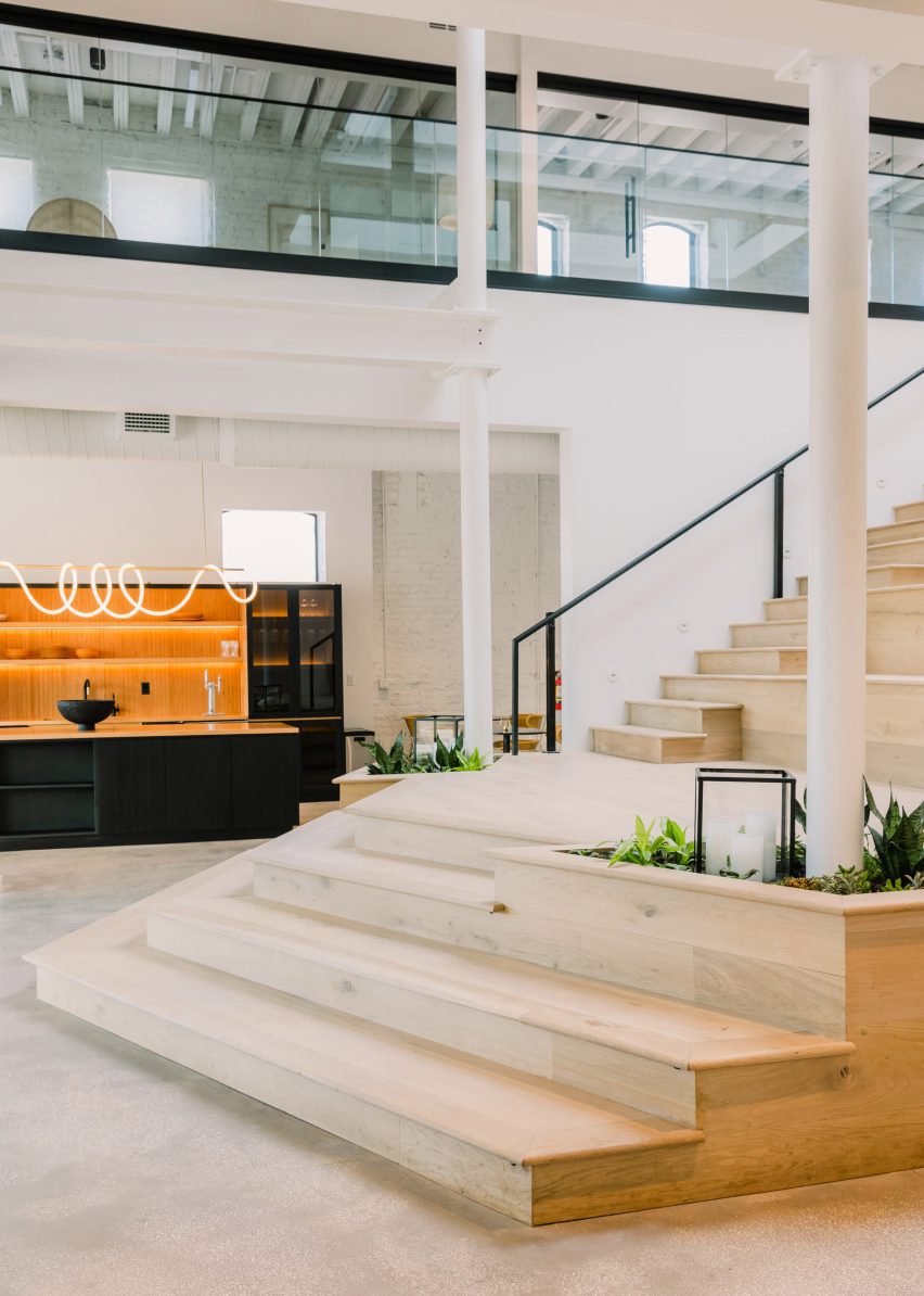 Industry West's showroom featuring wooden staircase