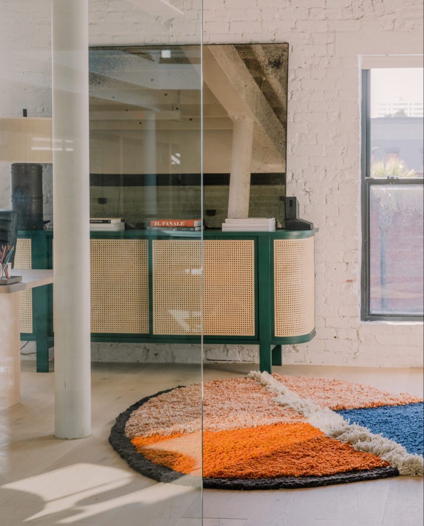 Industry West showroom featuring orange rug