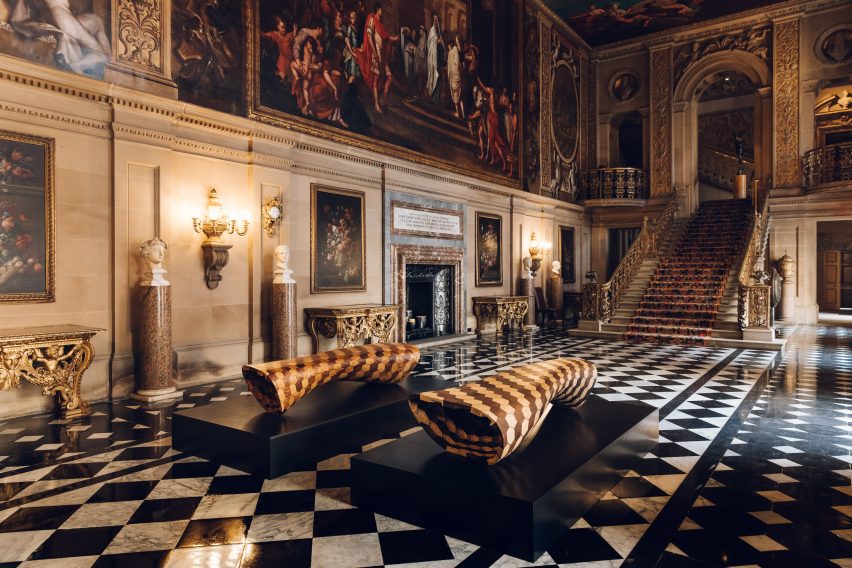 Interior of Chatsworth House featuring staircase and benches