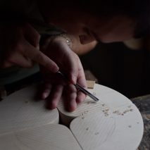 Photo of someone carving wood