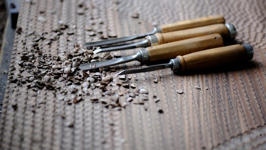 Photo of wood carving tools and wood