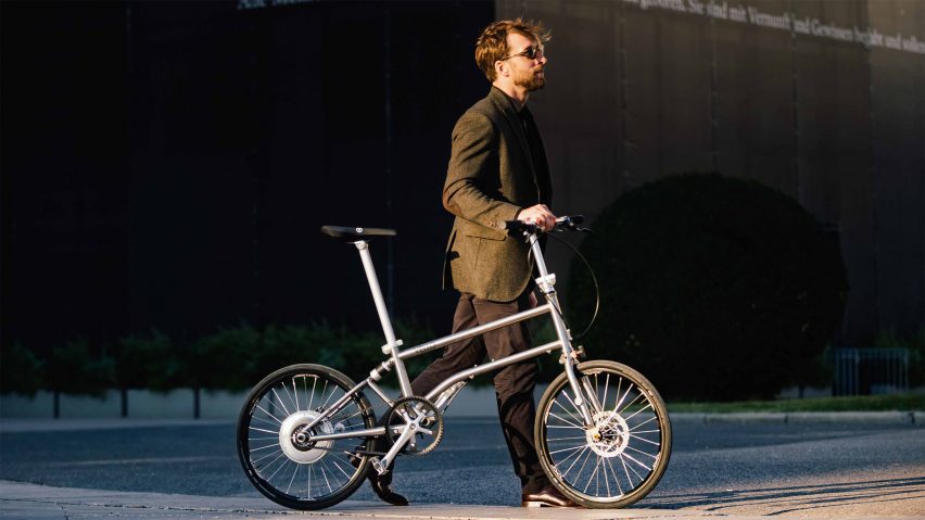 Photo of a person pushing a Vello bike