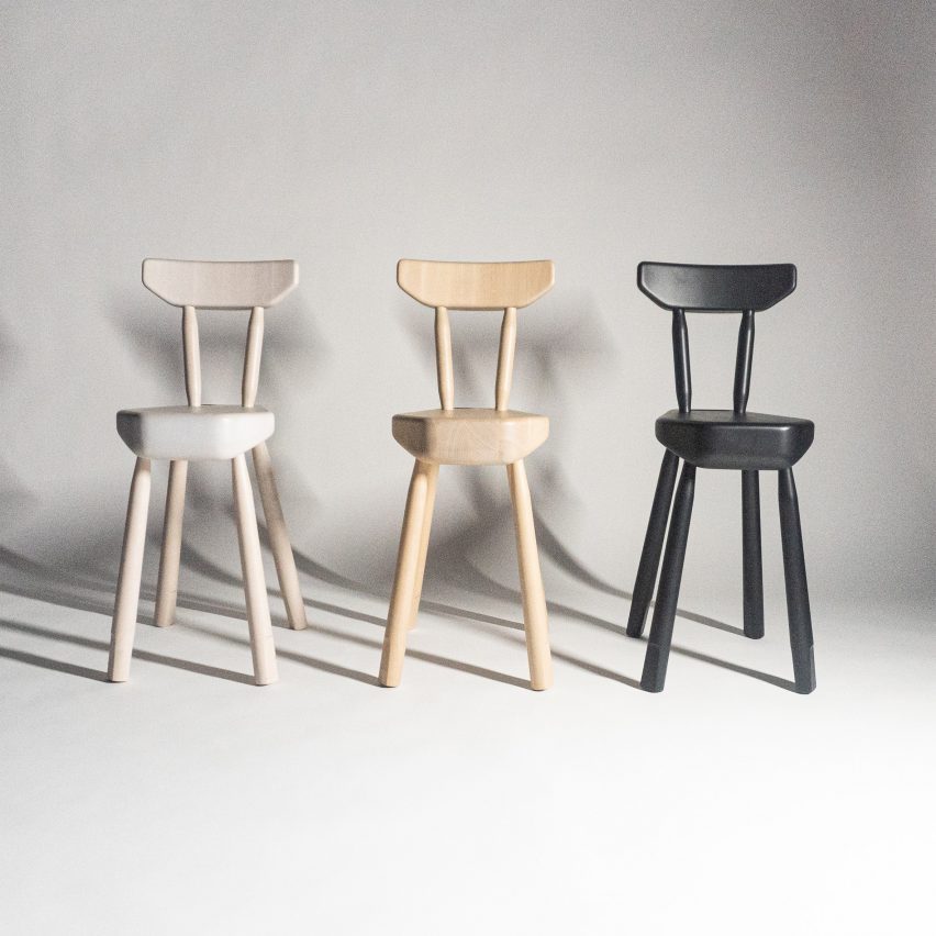 Three wooden chairs in natural, white and black stain finishes by Ca'lyah
