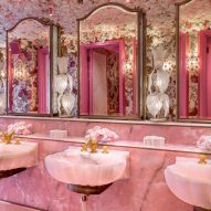 Eight bathrooms with colourful toilets and sinks