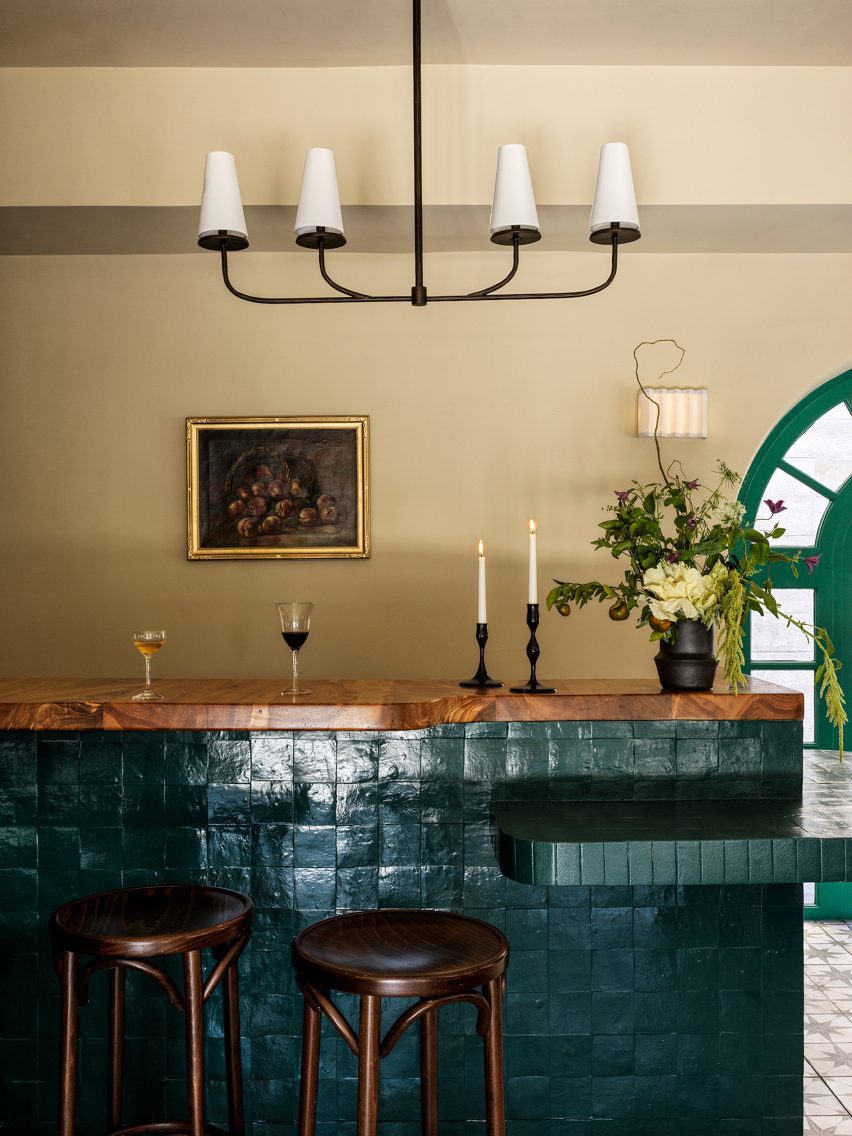 Bar clad in glossy green tiles