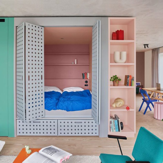 Perforated steel doors open onto cupboard bed in Domus Houthaven apartment
