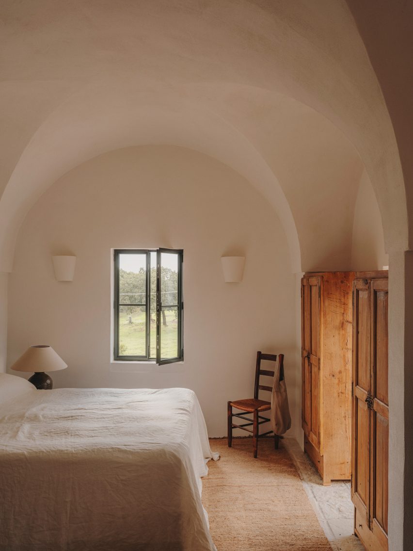 Earth-toned bedroom with vaulted ceiling