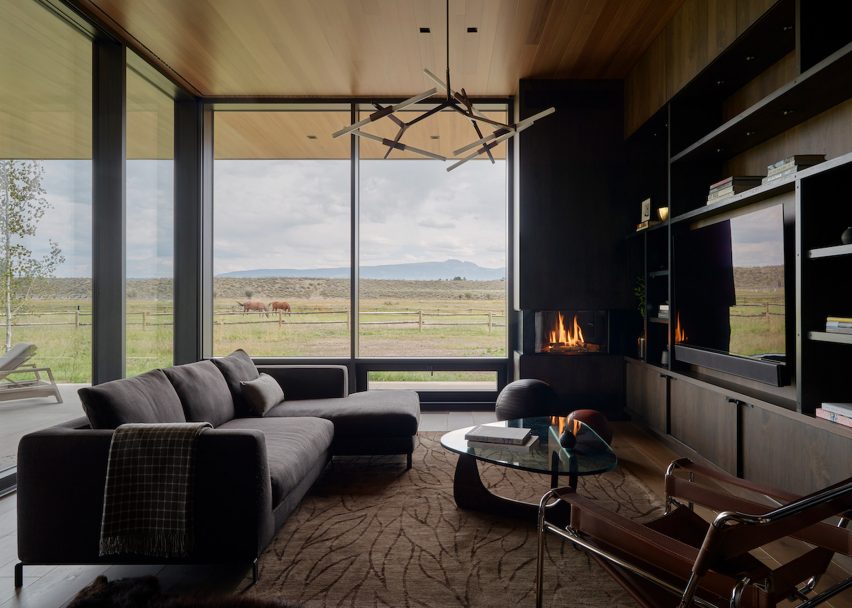 Communal zone with floor-to-ceiling glazing within Black Fox Ranch by CLB Architects