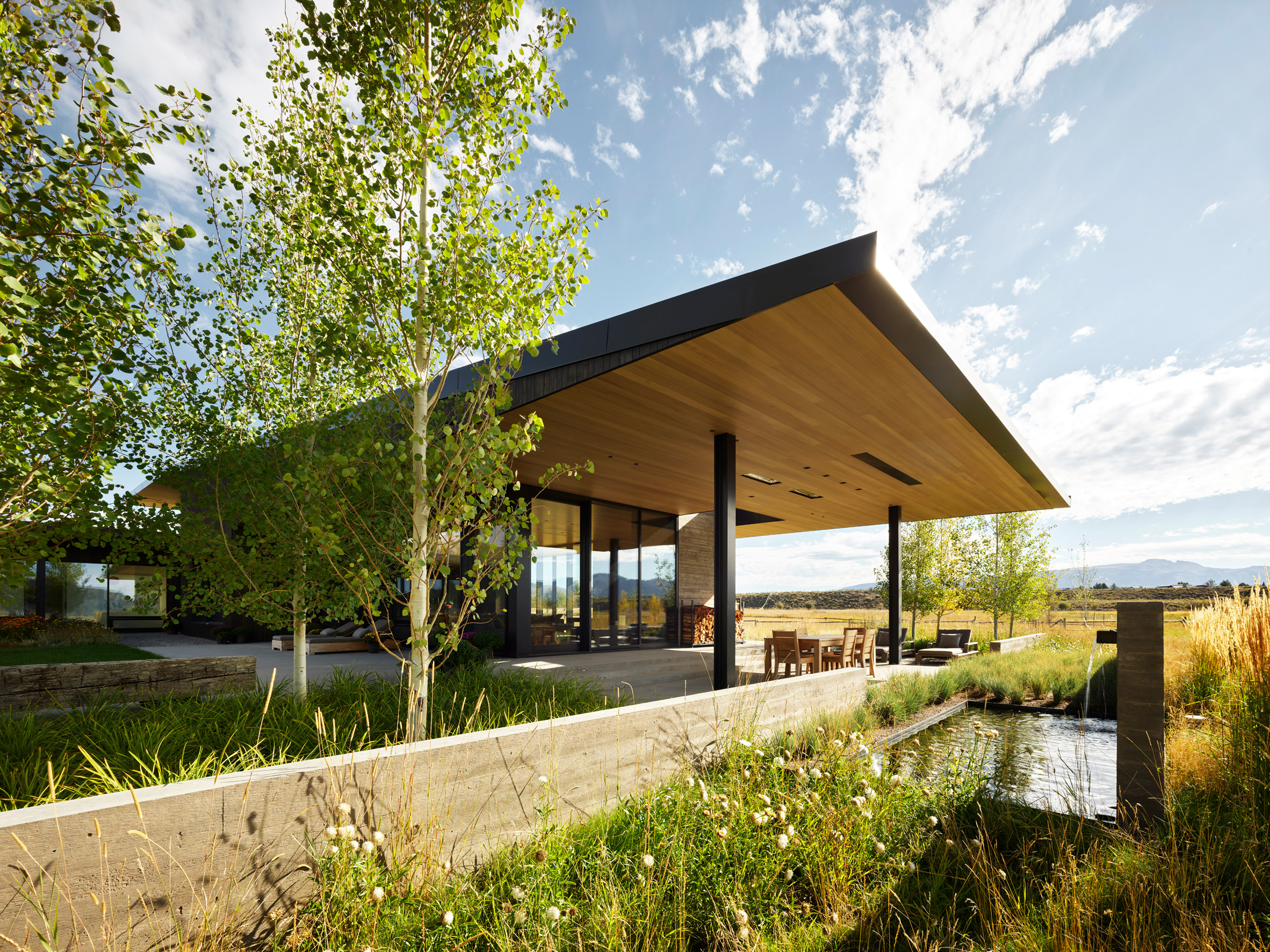 Cedar-clad home surrounded by vegetation in Wyoming