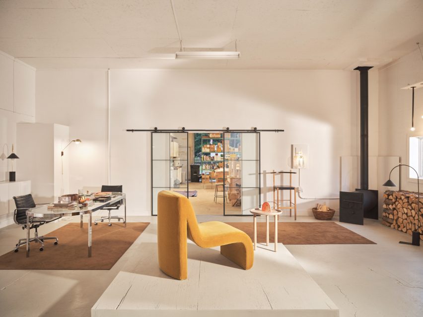 Wide shot of showroom with yellow chair in foreground