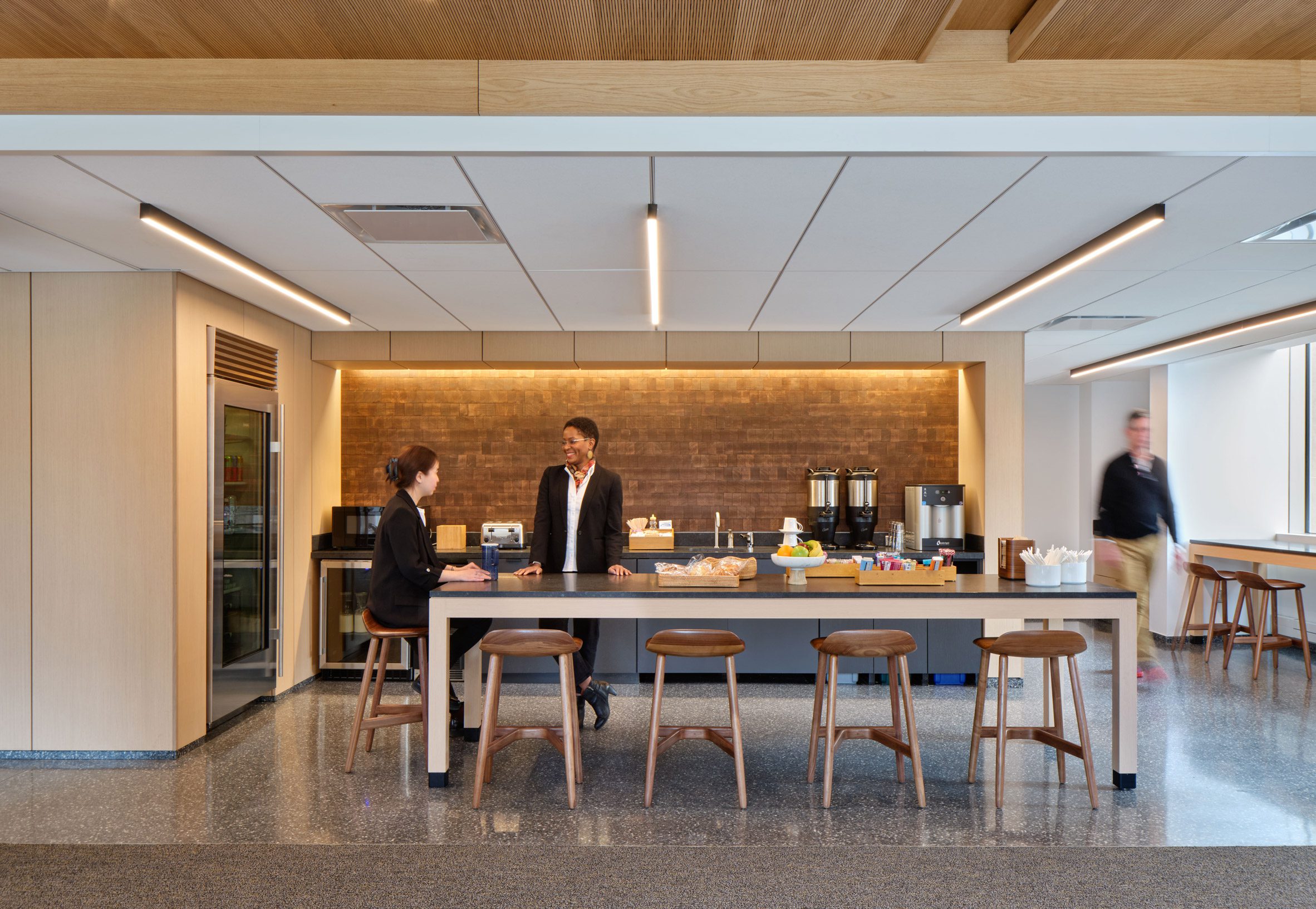 Open-plan kitchen island with terrazzo flooring underfoot