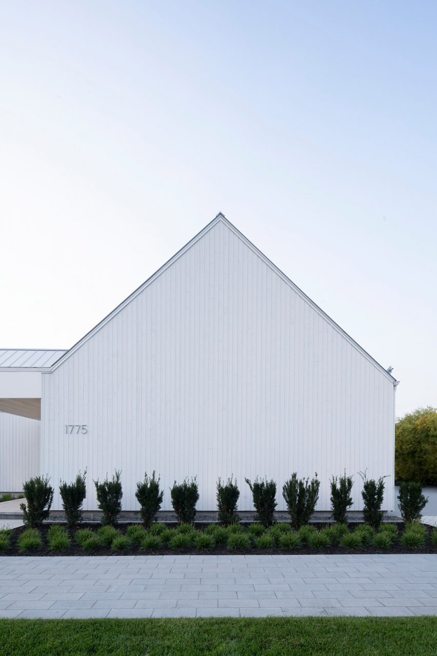 Gable end of a white timber-clad pitched structure