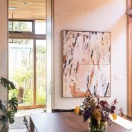 Dining room with a wood dining table and art on the walls