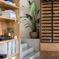 Room with concrete floors and steps and wooden storage