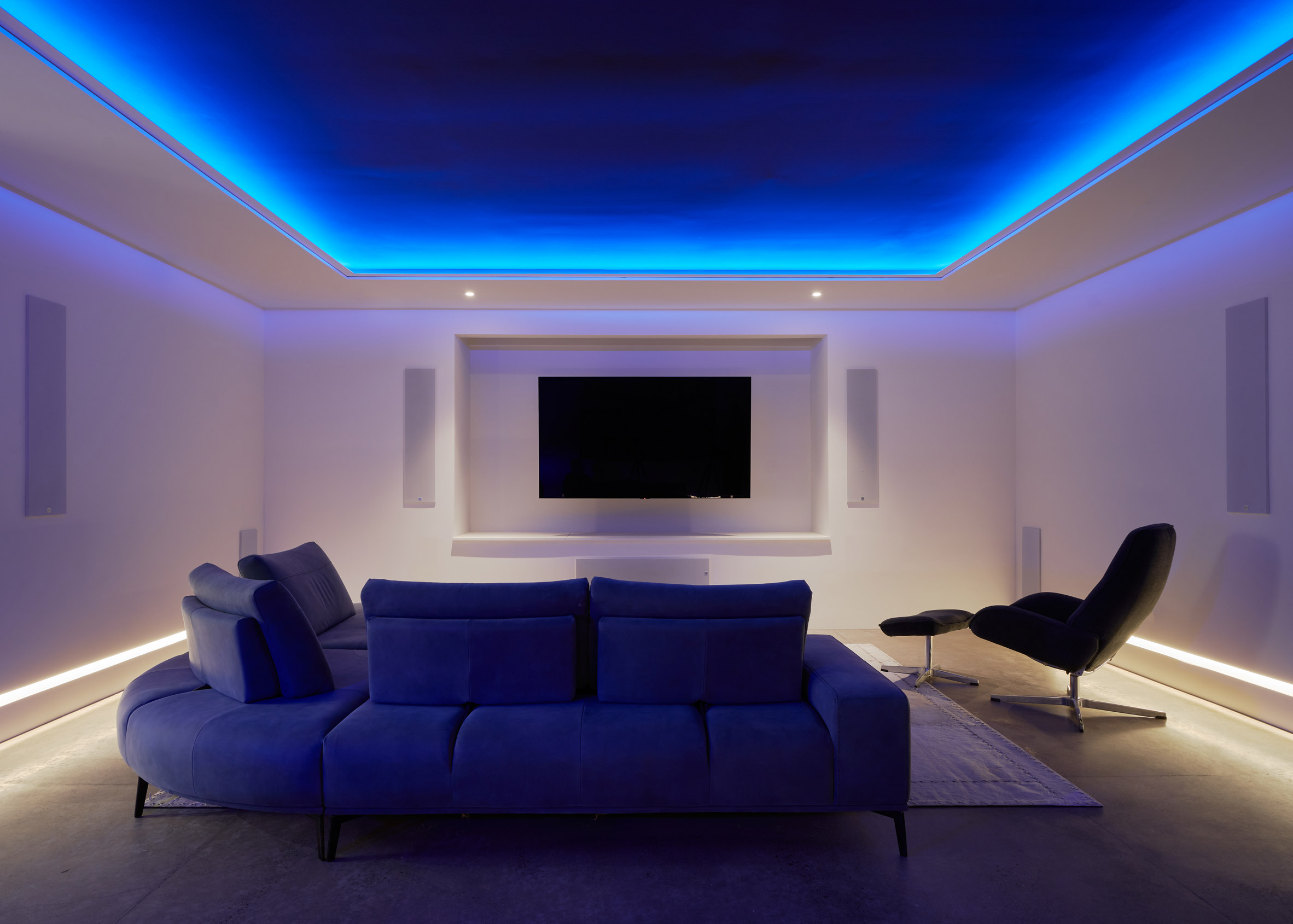 Basement of Oregon country house with blue-lit ceiling