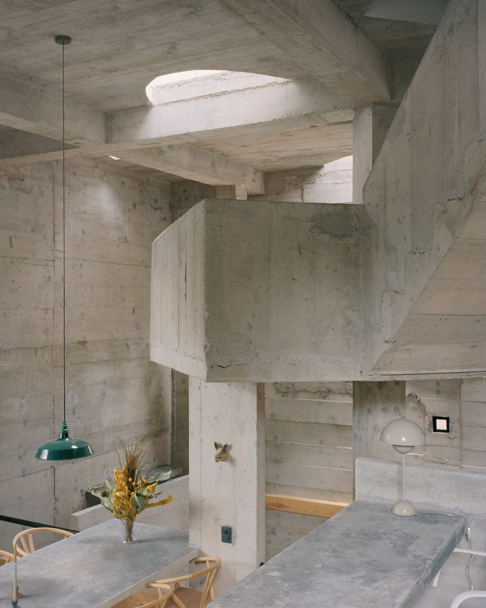 Light concrete walls within holiday home by Ludwig Godefroy in Mexican forest