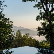 Corner of an infinity pool overlooking treetops