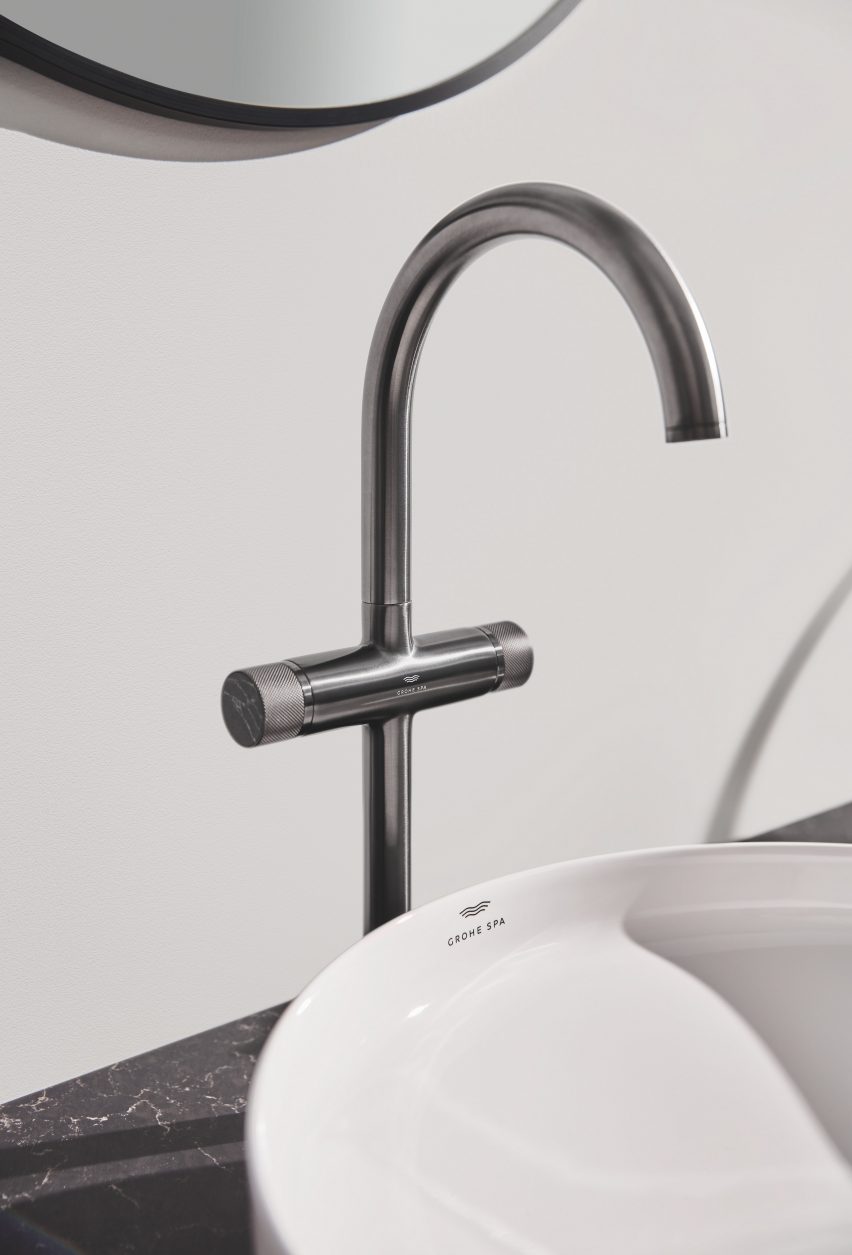 Silver mixer tap above sink