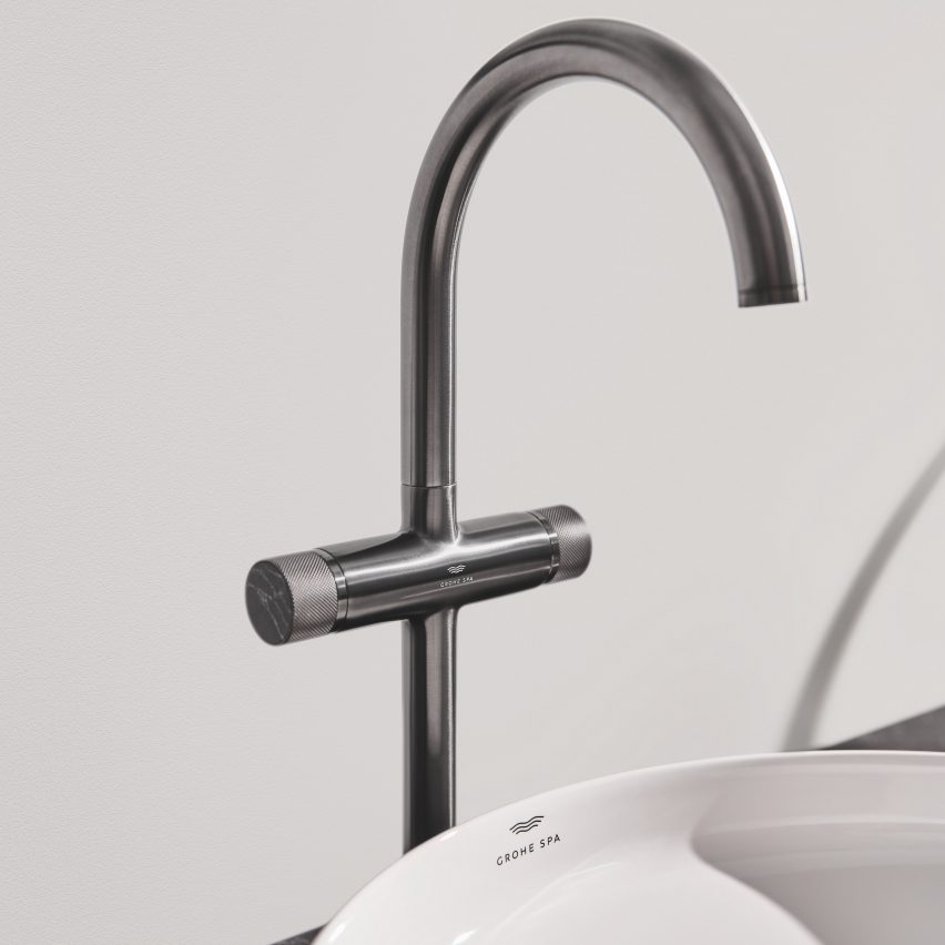 Silver mixer tap above sink