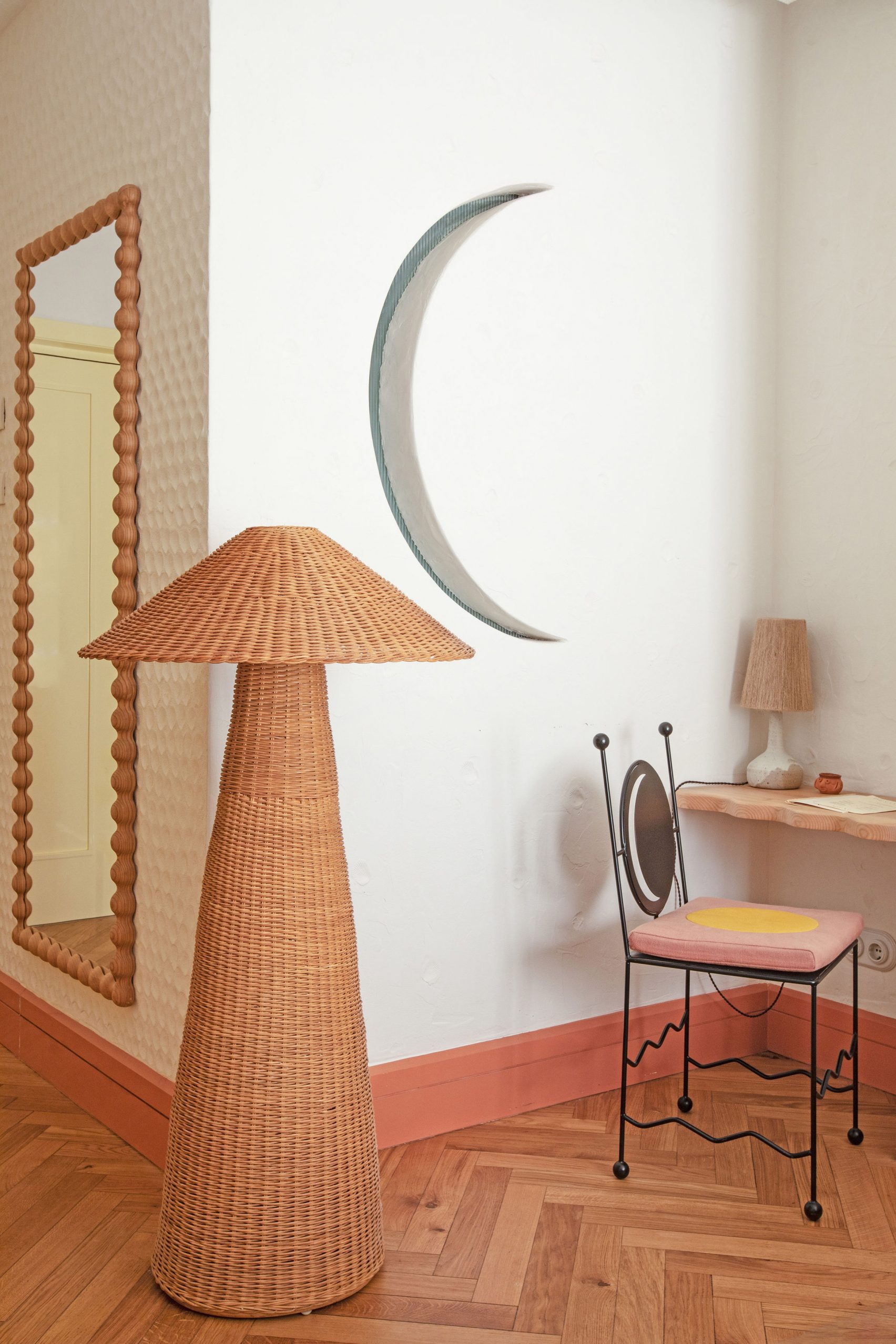 Desk and wicker lamp in Montesol Experimental hotel guest room