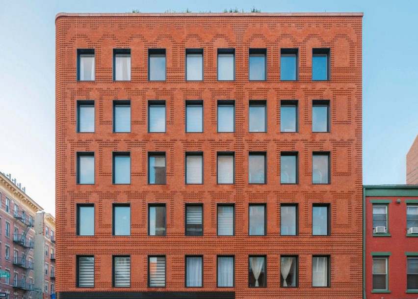 Exterior of the red-brick Grand Mulburry building by Morris Adjmi with a textured facade