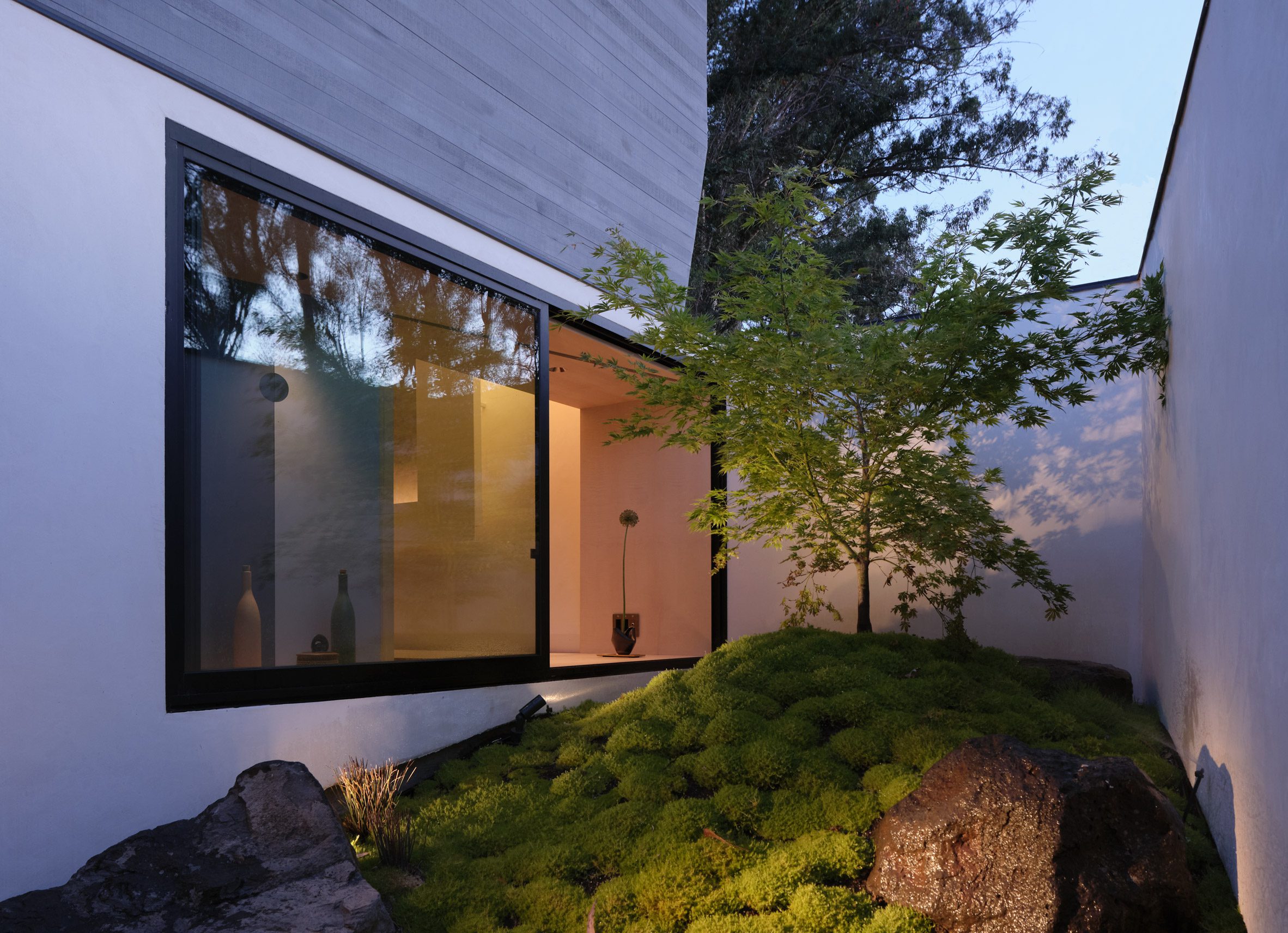 Exterior courtyard with mossy mounds