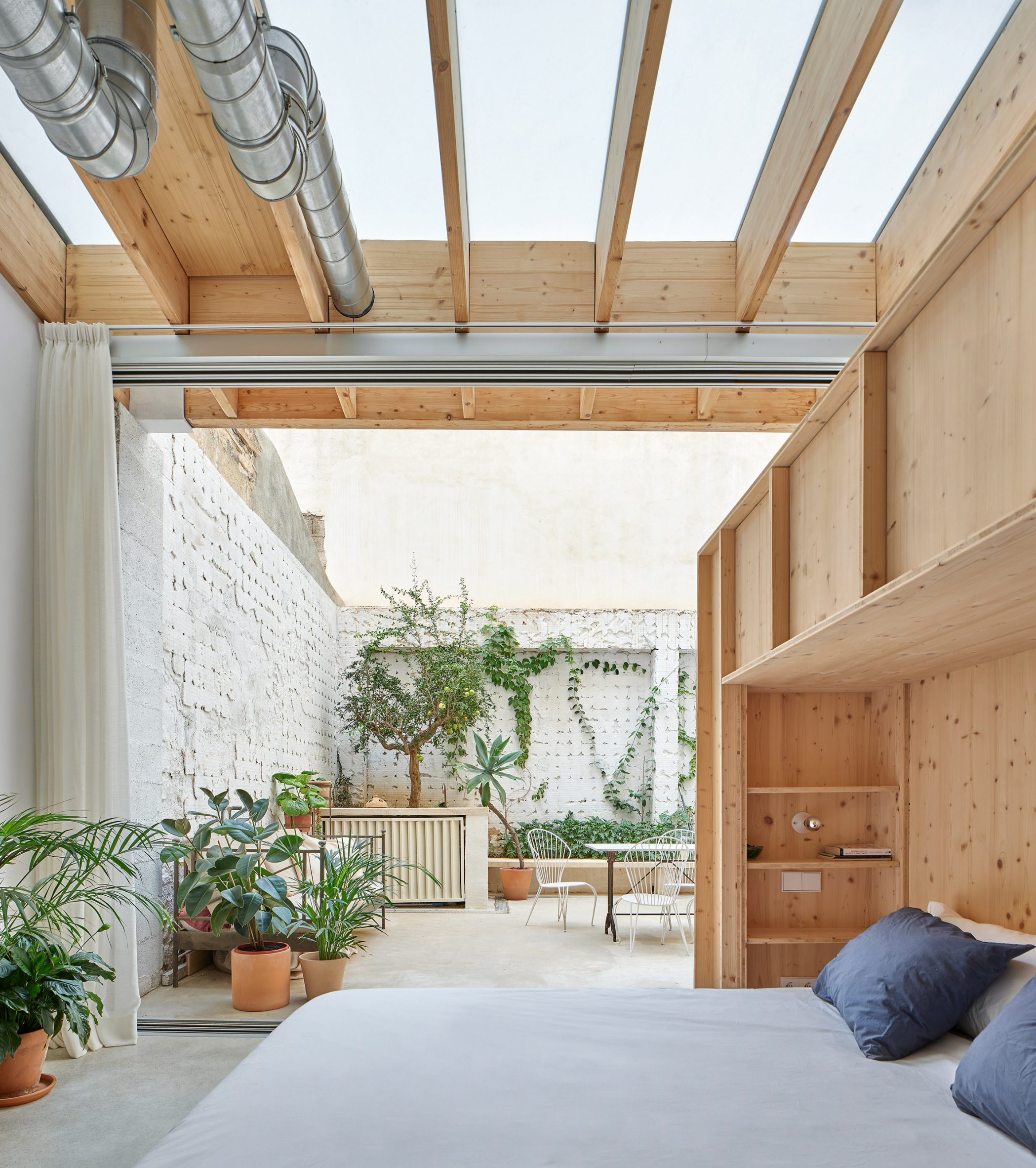 Bedroom of NZ10 Apartment that opens onto a courtyard