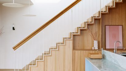 Wooden staircase inside Elsternwick Penthouse in Melbourne by Office Alex Nicholls