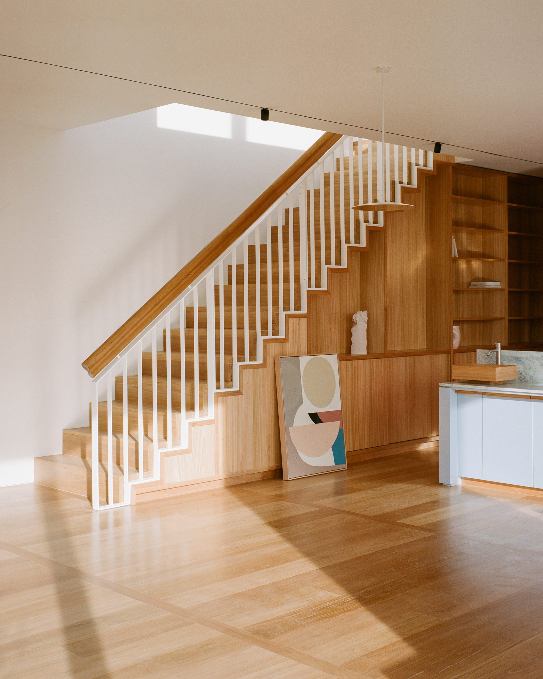 Wooden staircase inside Elsternwick Penthouse 