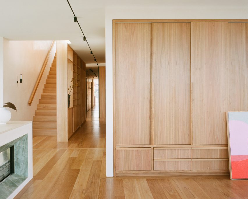 Timber storage and staircase in Melbourne apartment by Office Alex Nicholls