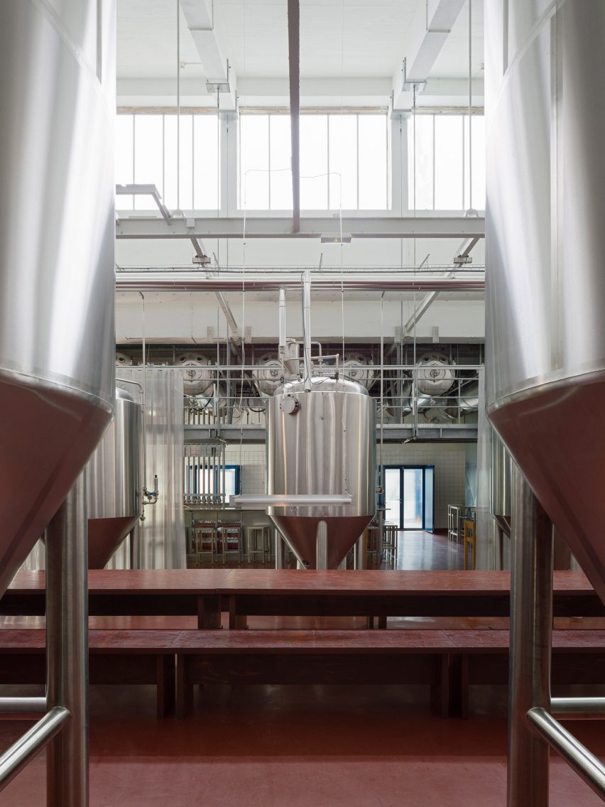Conical steel fermentation tanks within ÅBEN brewery in Copenhagen