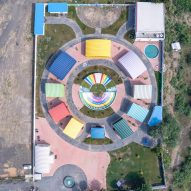 Aerial view of colourful metal school sheds an a circle