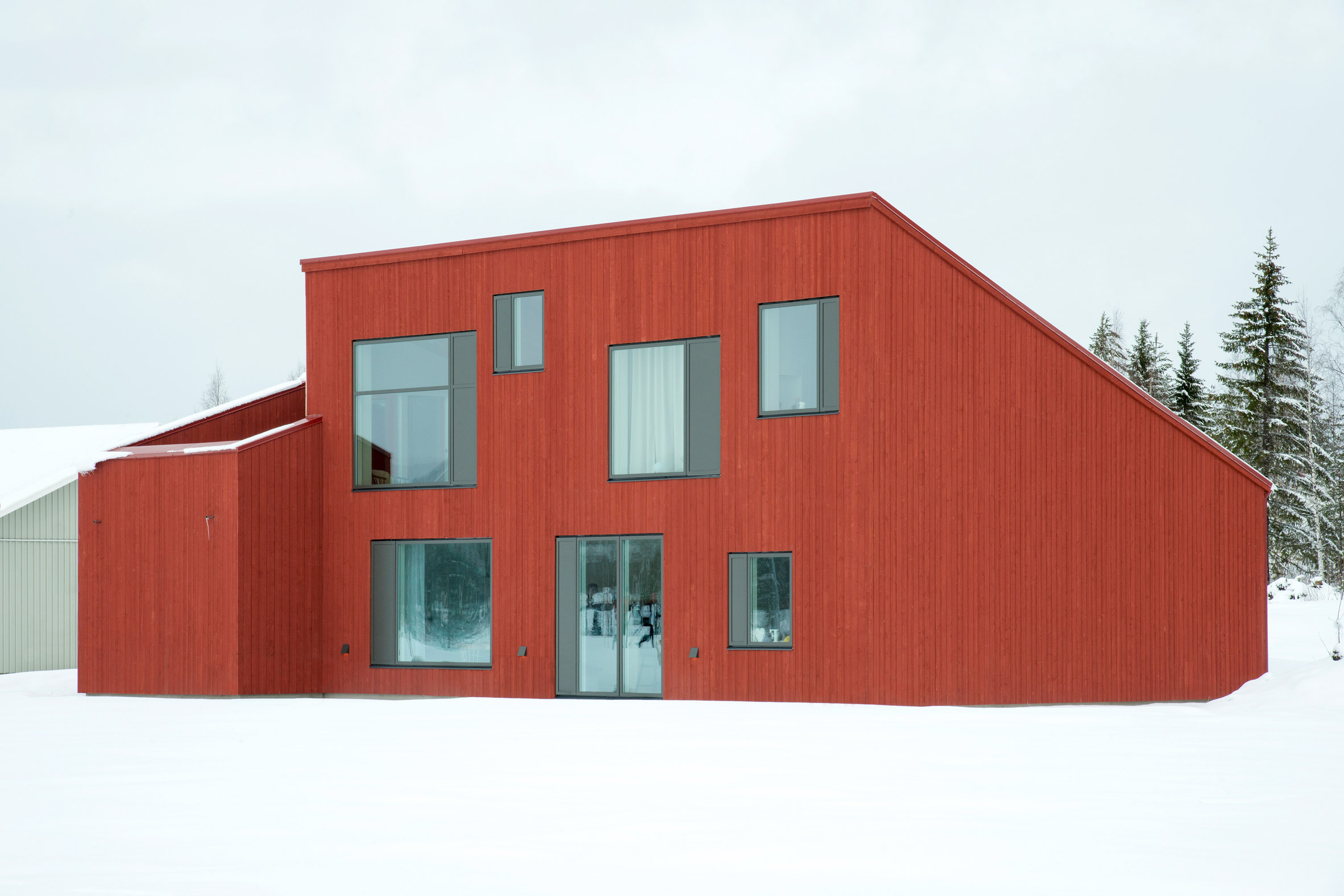 Red-painted house in snow in Sweden 