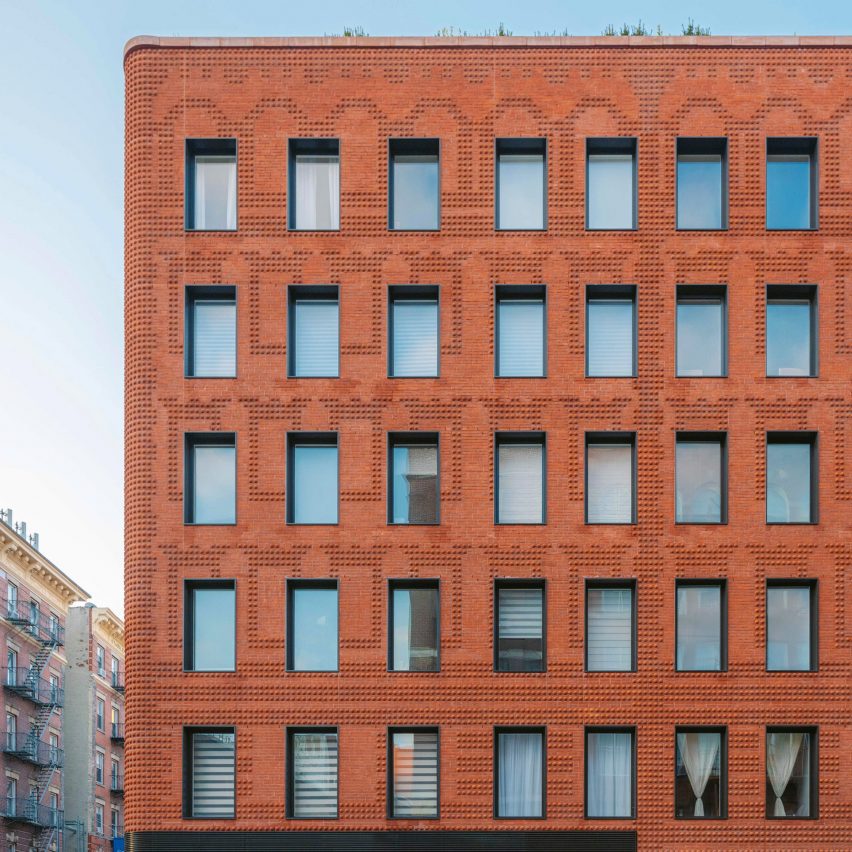 Exterior of the red-brick Grand Mulburry building by Morris Adjmi with a textured facade