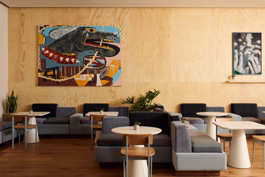 Artwork on timber-panelled walls within The Line Hotel by Handel Architects