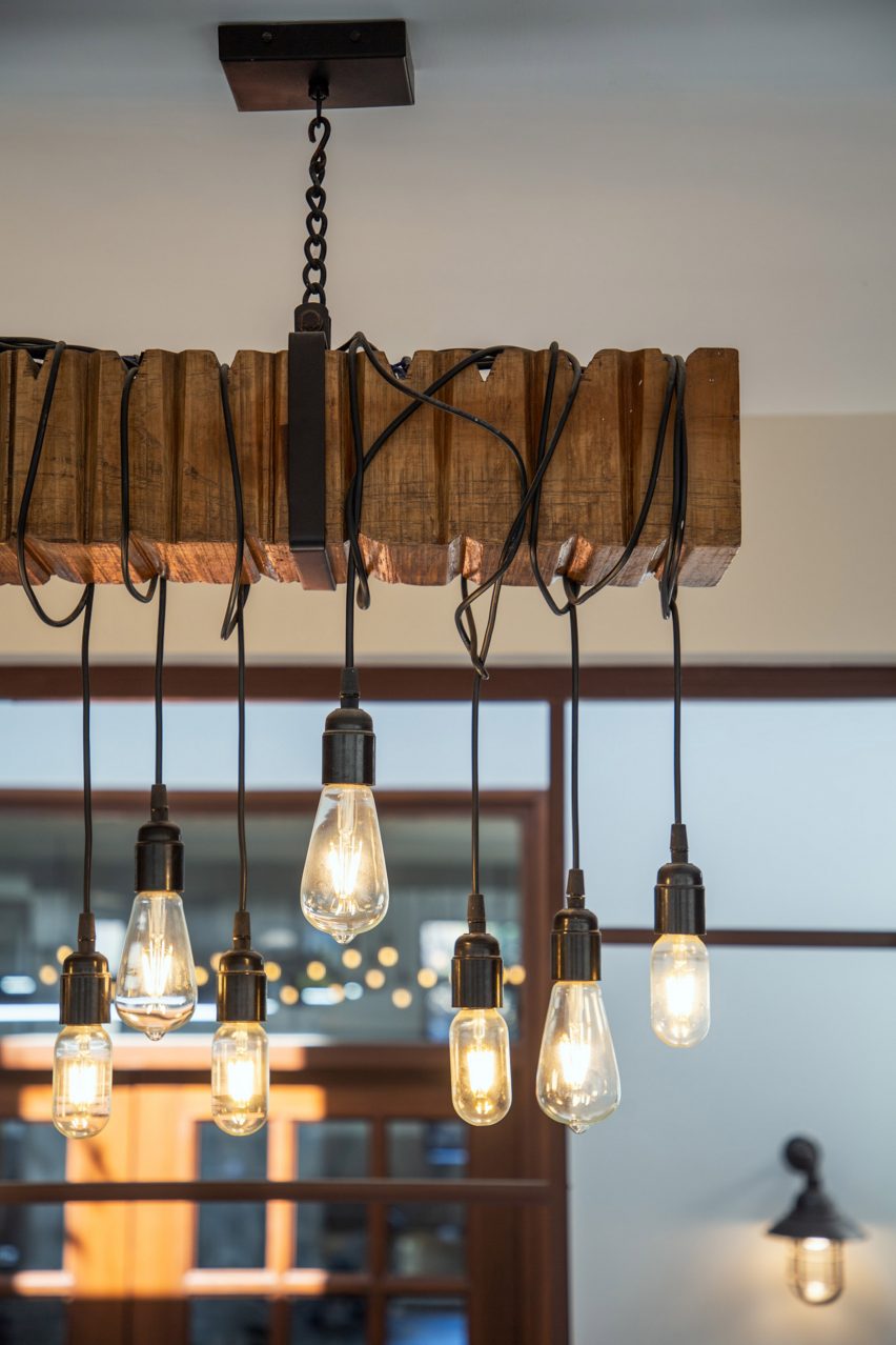 Lights hanging from suspended wooden rafter