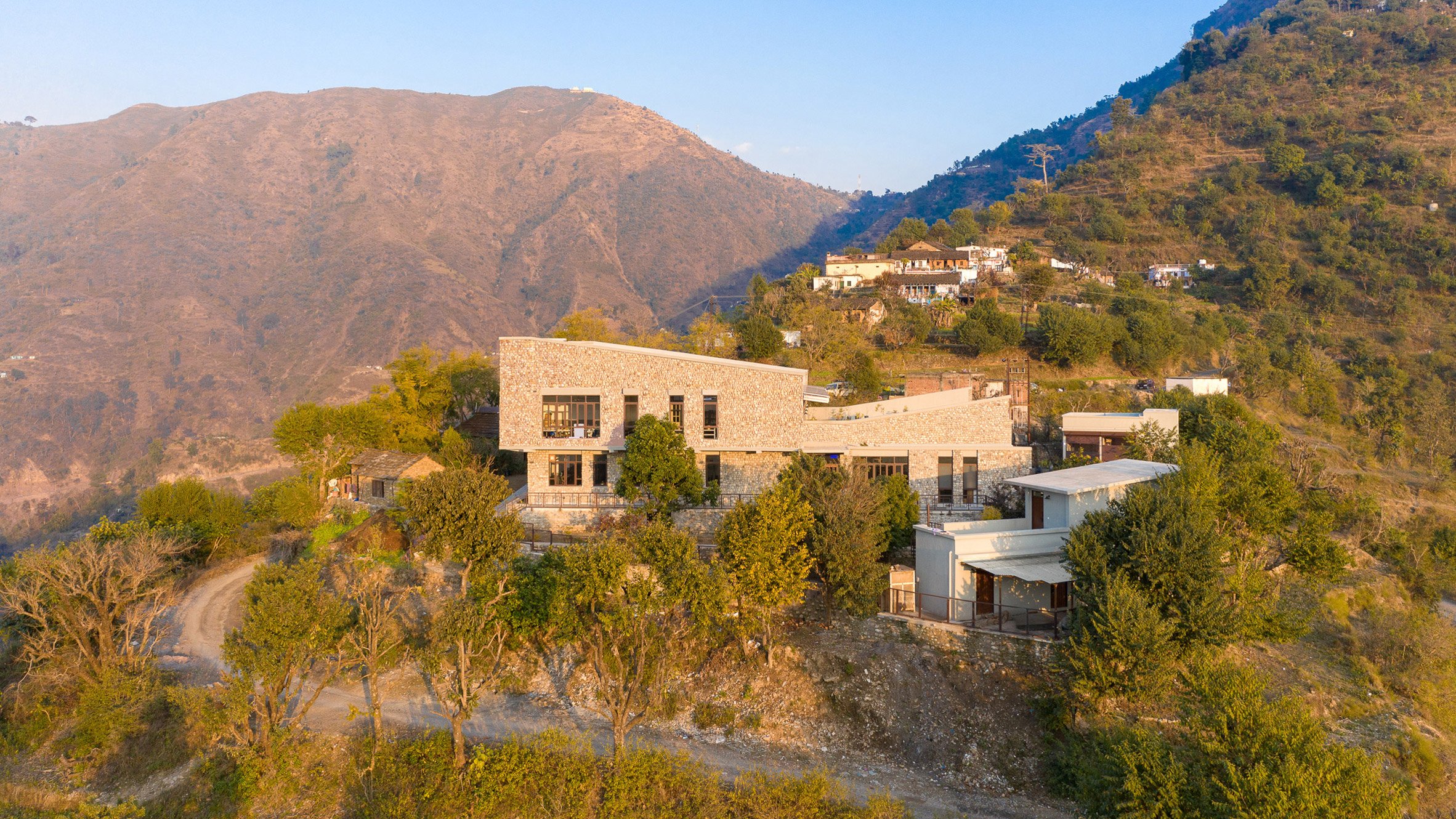 Exterior of The Lodsi Community Project for Forest Essentials factory by Morphogenesis