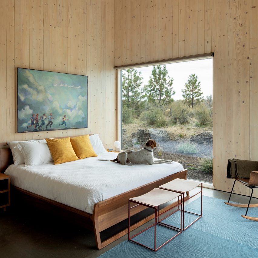 A bedroom interior with exposed timber