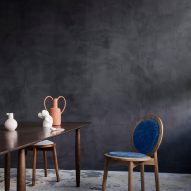 Blue Tranquebar chair by Ca'lyah in a room with a dark wood table