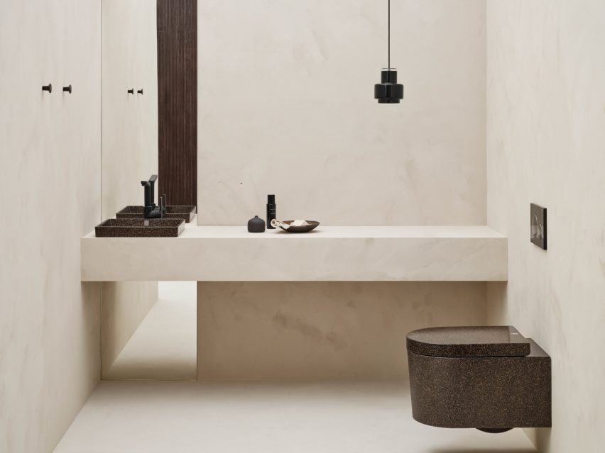 Bathroom with a dark brown Block toilet and sink by Woodio