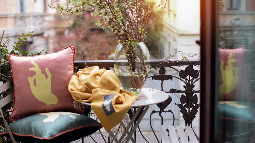 Photo of cushions and a blanket on a balcony